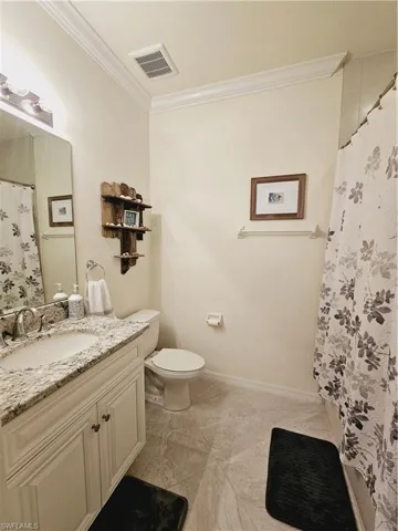 Guest bath with granite vanity & tiled shower/tub combo