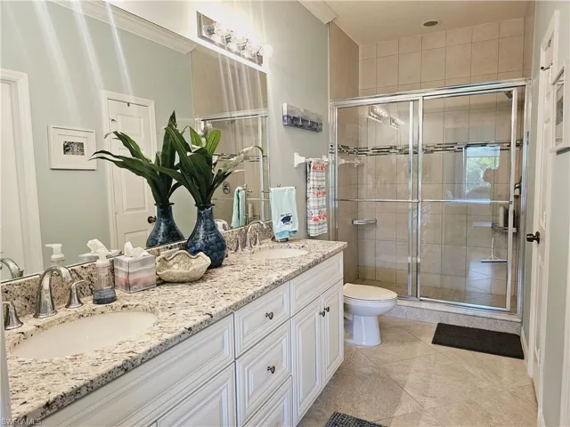 Beautiful master bath with tiled walk in shower & dual vanities