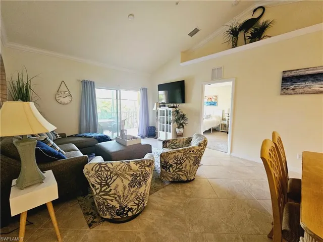 Large living area with sliders to the screened patio area