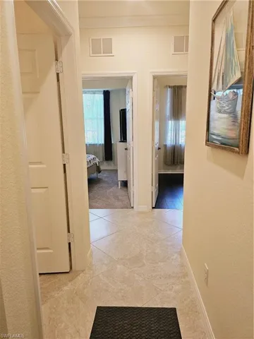 Tiled hallway to guest bath & guest bedrooms