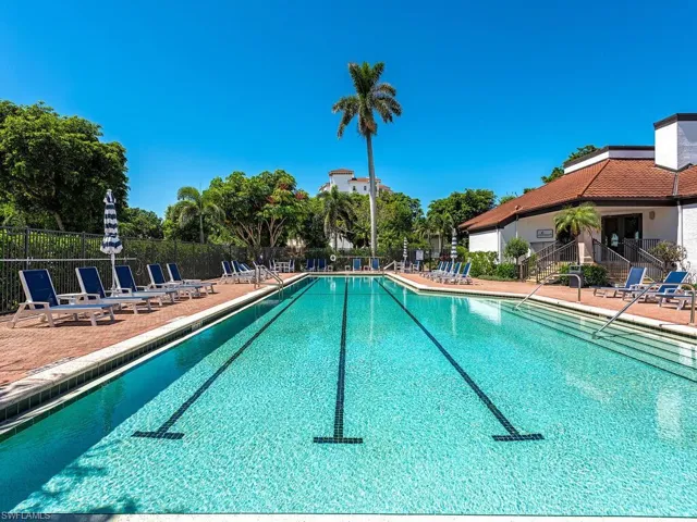 Community pool with a patio