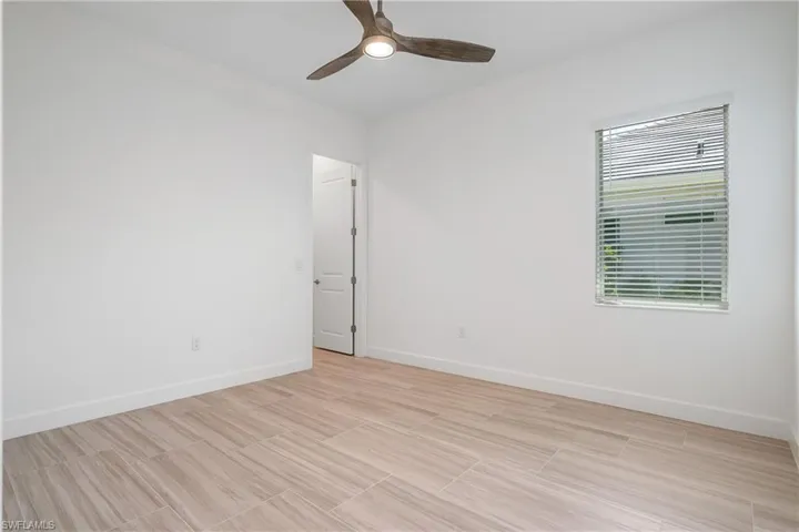 Spare room with ceiling fan