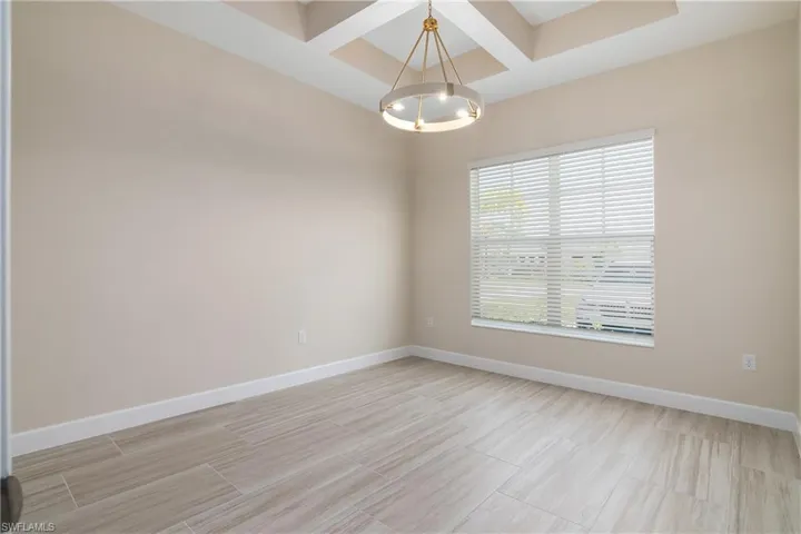 Spare room with coffered ceiling
