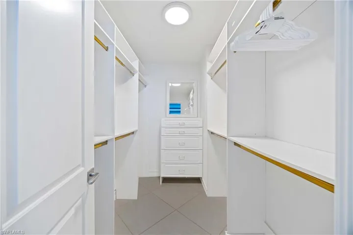 Walk in closet featuring light tile patterned floors