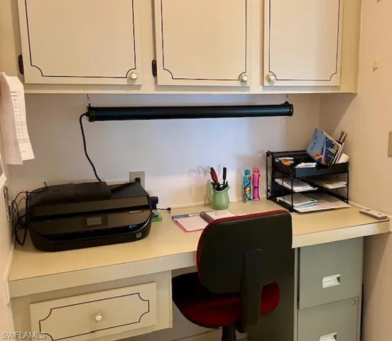 Office featuring built in desk