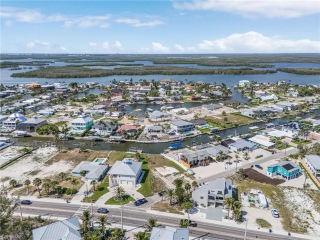 Aerial view of residential area with a large body of water