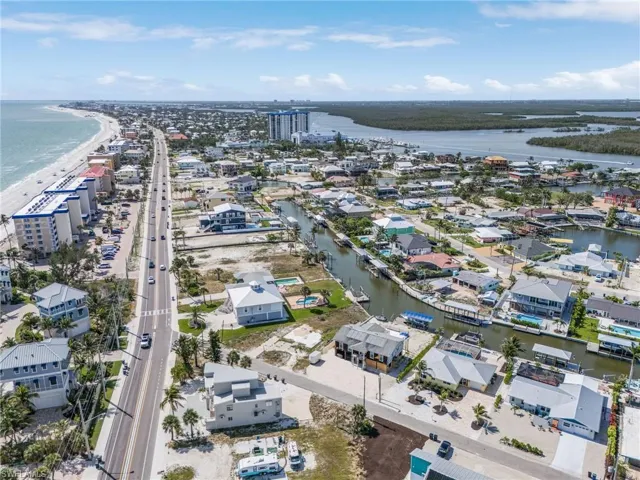 Aerial perspective of suburban area with a large body of water