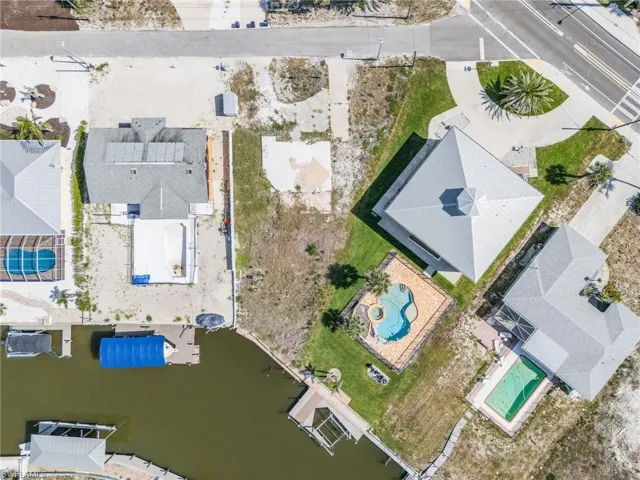 Aerial view of residential area featuring a pool