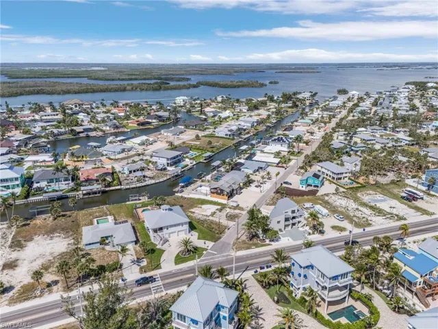 Aerial perspective of suburban area with a nearby body of water