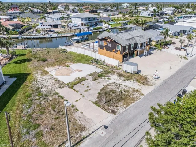 Aerial perspective of suburban area with a large body of water