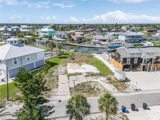 Aerial view of residential area featuring a large body of water