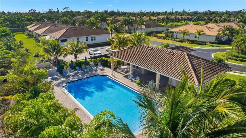Community pool with a residential view, a patio, and fence