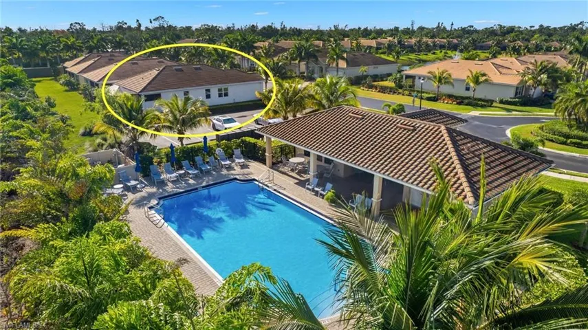 Pool with a residential view and a patio
