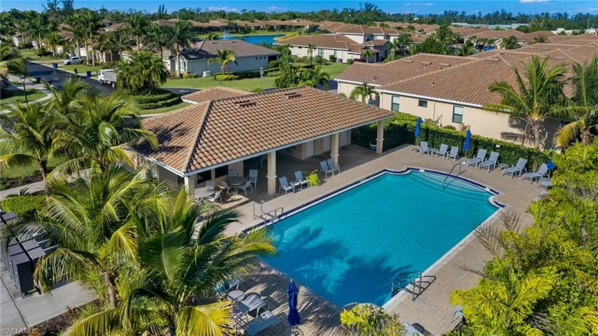 Pool with a residential view, a patio, and fence