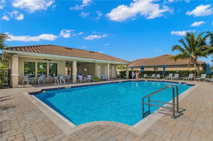 Pool featuring fence, a patio area, and ceiling fan