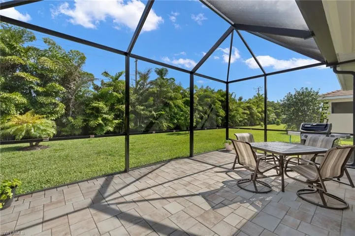 View of patio / terrace with glass enclosure and outdoor dining area