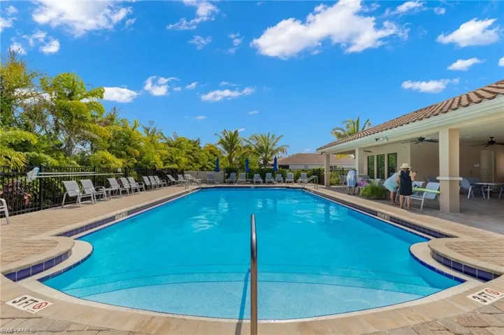 Pool featuring fence, a patio, and ceiling fan