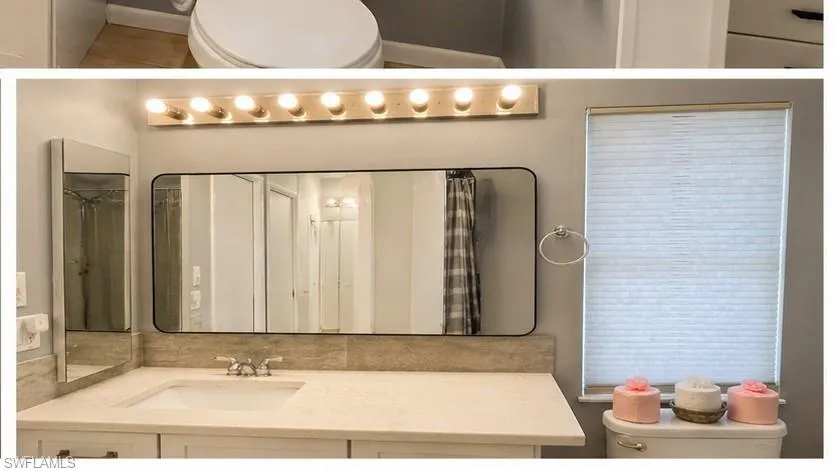 Vanity featuring a light-colored countertop, integrated sink, and brushed nickel faucet