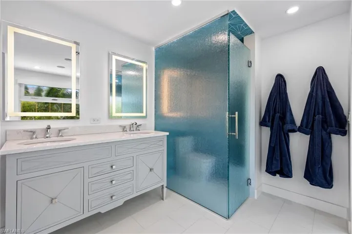 Double sinks with backlit mirrors