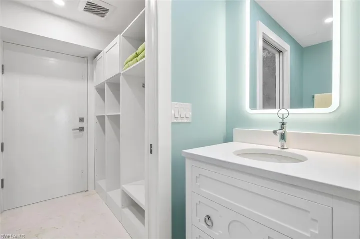 Bathroom 3 near guest bedrooms with laundry room