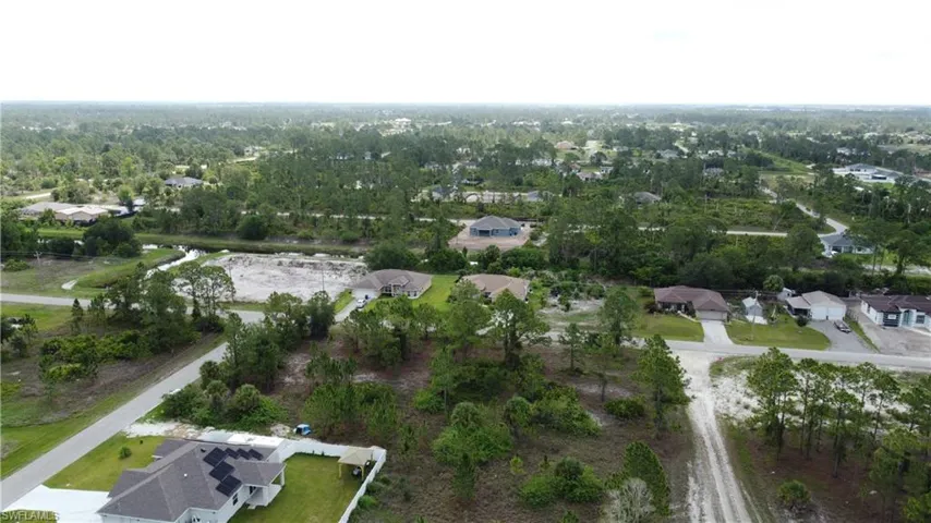 View of property location with nearby suburban area