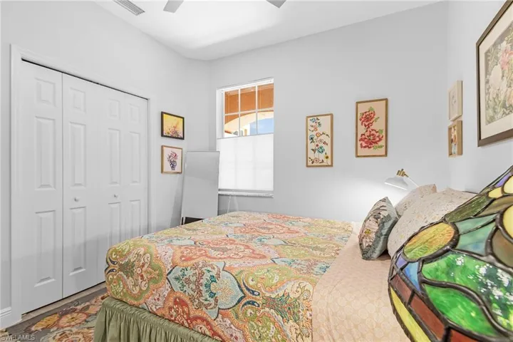 Bedroom featuring a closet, a ceiling fan, and wood finished floors