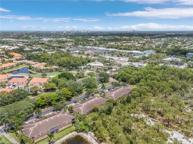 View of property location with a large body of water and nearby urban area
