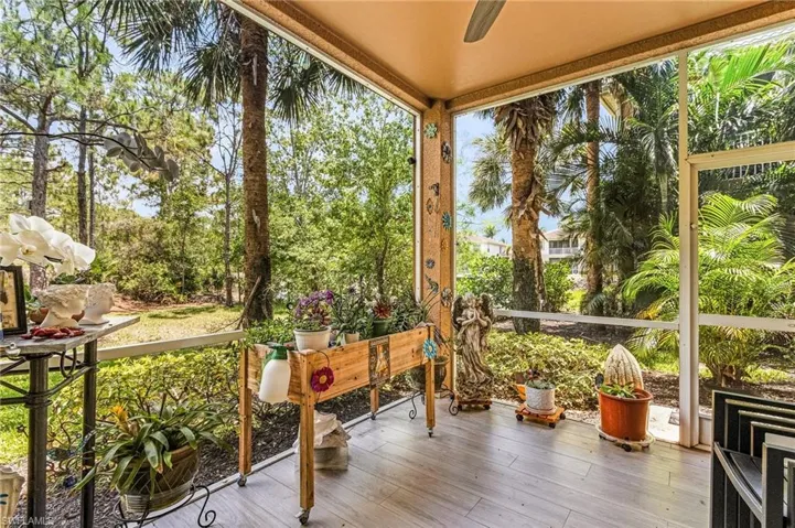 Sunroom / solarium featuring wood finished floors