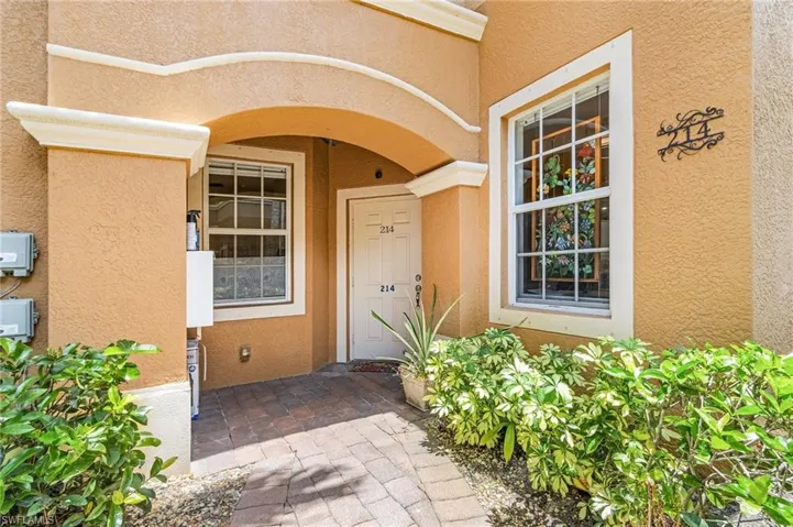 Entrance to property featuring stucco siding