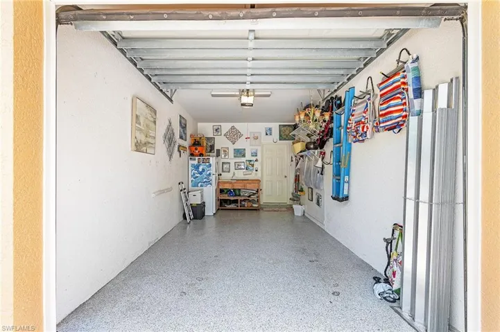 Garage featuring a garage door opener