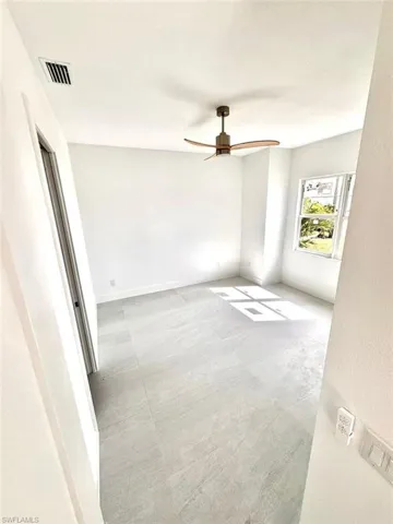 Spare room featuring ceiling fan