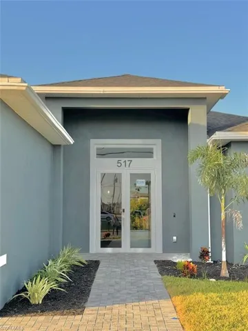 View of exterior entry featuring french doors