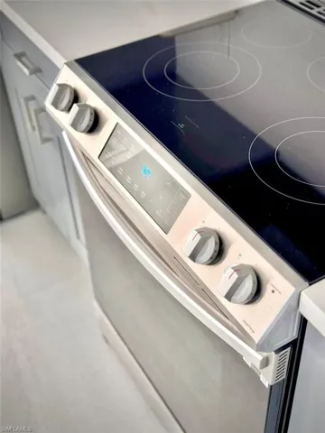Room details featuring white electric range