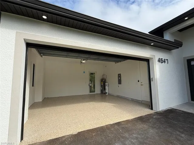 Garage featuring electric panel