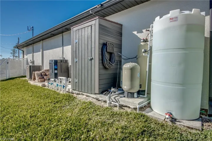The right side of the home has all of the exterior mechanicals lined up out of sight and behind a fence. Extra pavers are available. Whole house reverse osmosis water system, spool equipment, heater, AC unit.