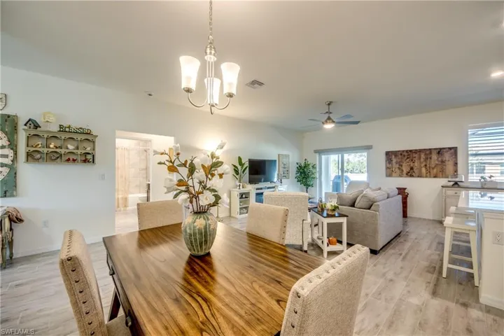 Dining area is adjacent to living room and kitchen.