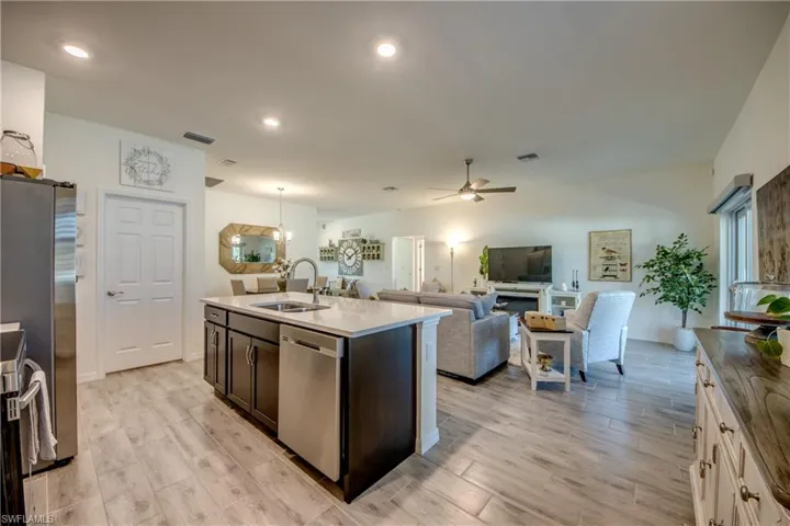View when exiting the primary bedroom. The closed door on the left accesses the laundry room and garage.