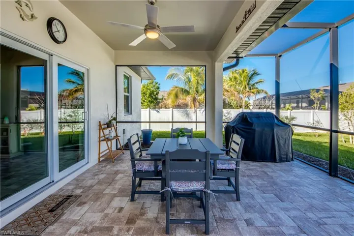 Original patio was extended and screened in. Paver decking now measures appx 40' long x 16' deep. Wonderful spot to enjoy dining al fresco. Sliders access Great room.