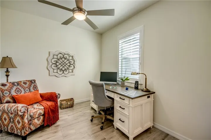 Den/office is located near the front door and measures appx 11'x10'. Impact resistant windows and Plantation shutters throughout home. No doors were installed for den during construction.