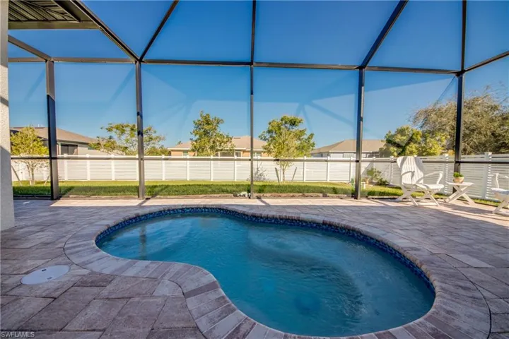 Combo spa/pool (2024) is versatile for year-round use. Completely screened with large paver deck. Spool measures appx 11'x6'x3' deep.