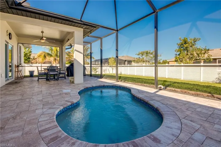 Combo spa/pool is versatile for year-round use. Completely screened with large paver deck. Spool measures appx 11'x6'x3' deep.