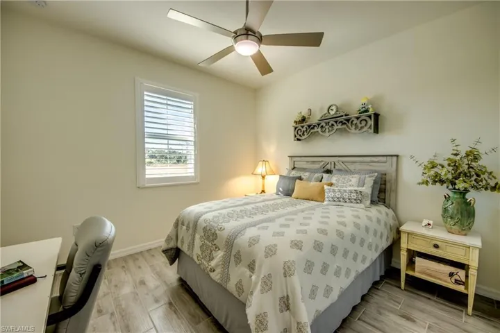 Bedroom 2 measures appx 12'x11' and is just a few steps from the secondary bathroom. Window looks out to front yard. Ceiling fans are in all bedrooms. NO CARPET! Tile flooring throughout home.