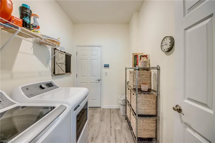 Laundry room is placed between the kitchen and garage for easy access. Plenty of storage room in here. Washer/dryer will convey with the sale.