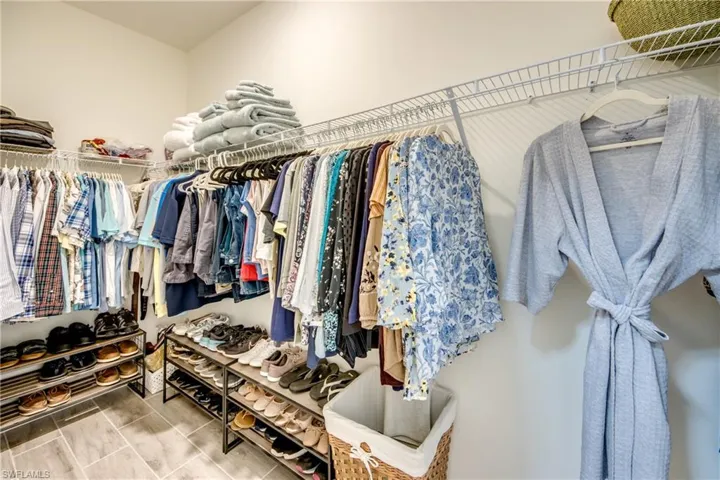 Walk-in closet in primary bedroom measures 11' long!