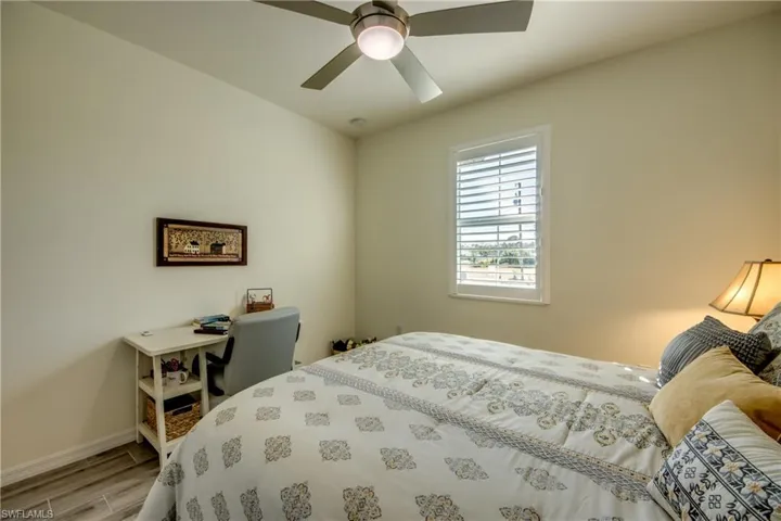 Bedroom 2 measures appx 12'x11' and is just a few steps from the secondary bathroom. Window looks out to front yard. Ceiling fans are in all bedrooms. NO CARPET! Tile flooring throughout home.
