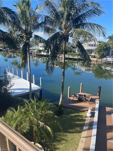 Dock area featuring a water view