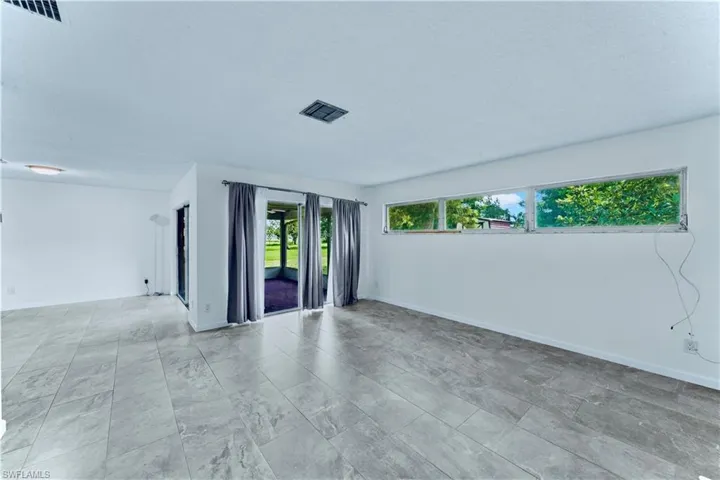 Unfurnished room with baseboards
