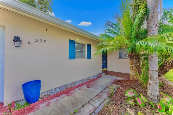 Doorway to property with stucco siding