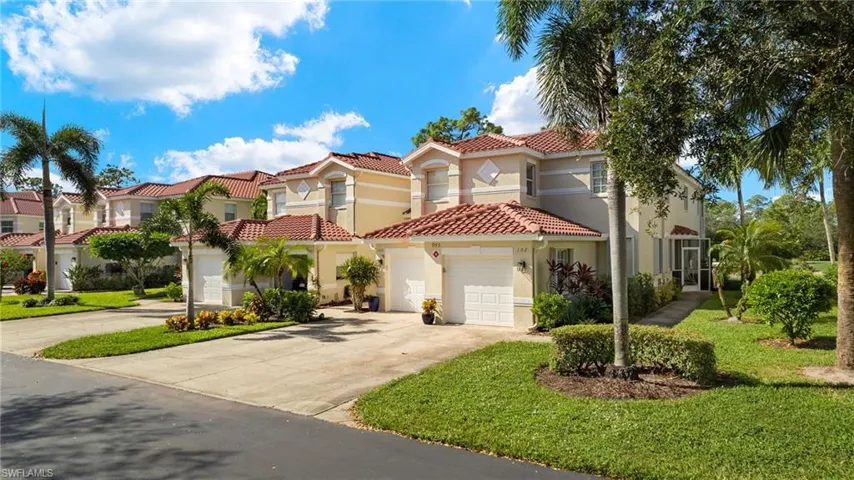 Mediterranean / spanish home featuring a garage and a front yard