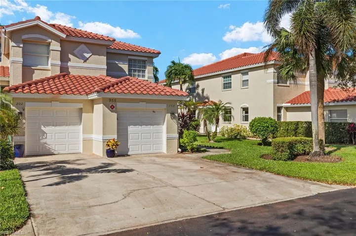 Mediterranean / spanish home with a garage